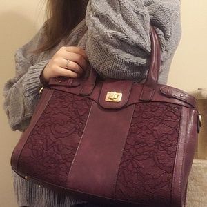 Burgundy bag with lace on the front
